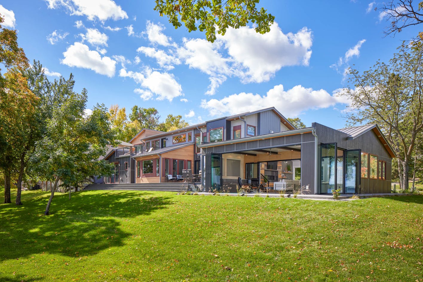 folding glass walls by NanaWall in lakeside home